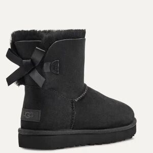 Genuine Uggs size 9 (W) - good lightly used condition, cute bows on back.